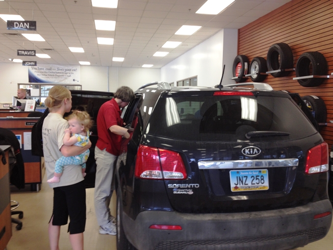 Technician inspecting a car seat